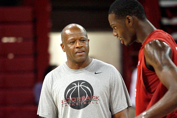 Arkansas coach Mike Anderson talks to forward Jacorey Williams during a 2012 practice at Bud Walton Arena in Fayetteville. 