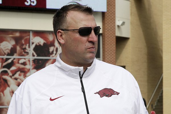 Arkansas coach Bret Bielema leaves the field after an NCAA college football game against South Carolina in Fayetteville, Ark., Saturday, Oct. 12, 2013. South Carolina defeated Arkansas 52-7. (AP Photo/Danny Johnston)
