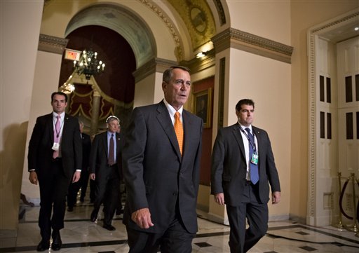 Speaker of the House John Boehner, R-Ohio, walks to the chamber for the vote on a Senate-passed bill that would avert a threatened Treasury default and reopen the government after a partial, 16-day shutdown, at the Capitol in Washington on Wednesday. The end to the rancorous standoff between the Democratic-controlled Senate and the Republican-controlled House was hastened by the imminent deadline to extend the debt ceiling to avoid a national default. (AP Photo/J. Scott Applewhite)