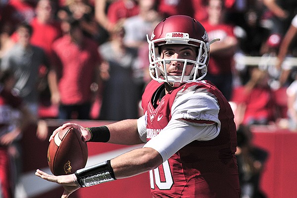 Arkansas quarterback Brandon Allen passes during the first half of an NCAA college football game against South Carolina in Fayetteville, Ark., Saturday, Oct. 12, 2013. (AP Photo/April L Brown)