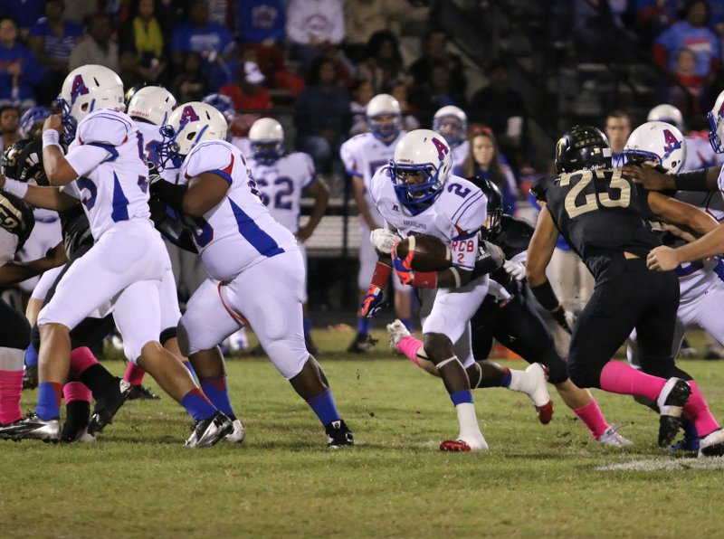 Arkadelphia running back Kris Oliver runs through a hole during first-half action against Robinson. The Badgers won 64-22. Arkadelphia is among a few teams that have a firm hold on their conference title hopes heading into Week 7.