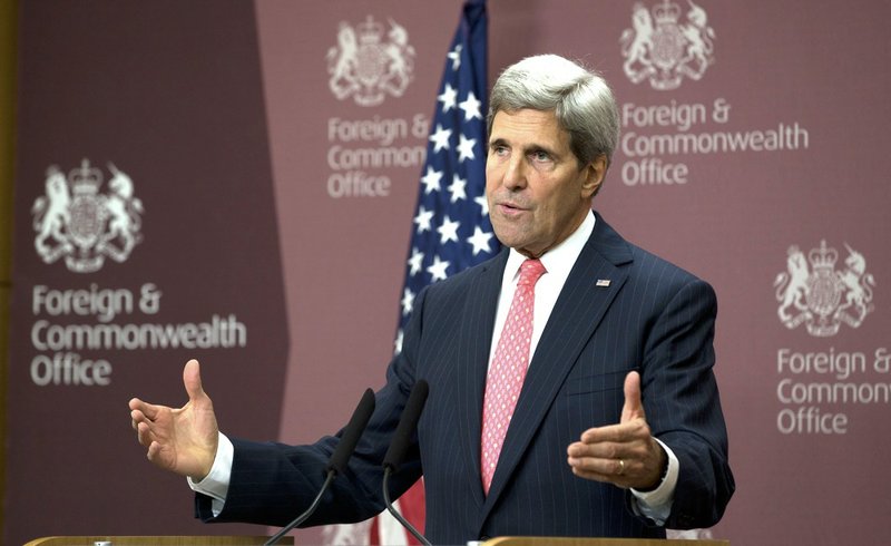 U.S. Secretary of State John Kerry speaks to the media at the British Foreign Office in London on Tuesday, Oct. 22, 2013. Kerry said negotiations with Assad's government are likely to take place late next month, but would not confirm they have been set for Nov. 23, a date mentioned by other officials. 