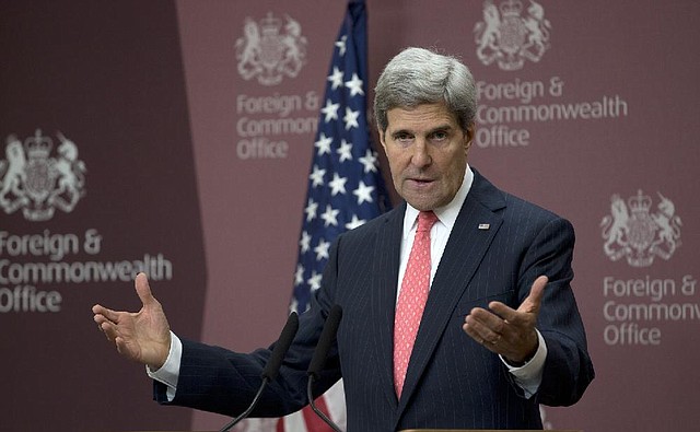 U.S. Secretary of State John Kerry speaks Tuesday at the British Foreign Office in London. Kerry said negotiations with Bashar Assad’s government are likely to take place late next month, but he would not confirm they have been set for Nov. 23, a date mentioned by other officials. 