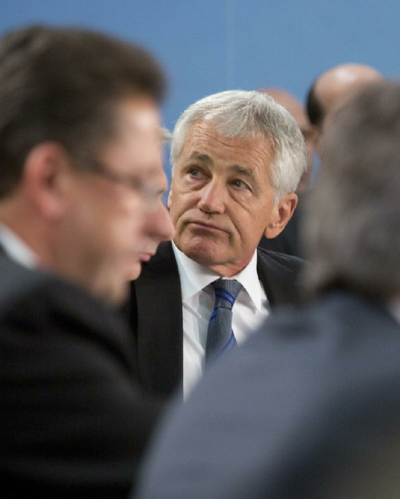 U.S. Secretary of Defense Chuck Hagel waits for the start of a meeting of the North Atlantic Council of defense ministers at NATO headquarters in Brussels on Tuesday.

