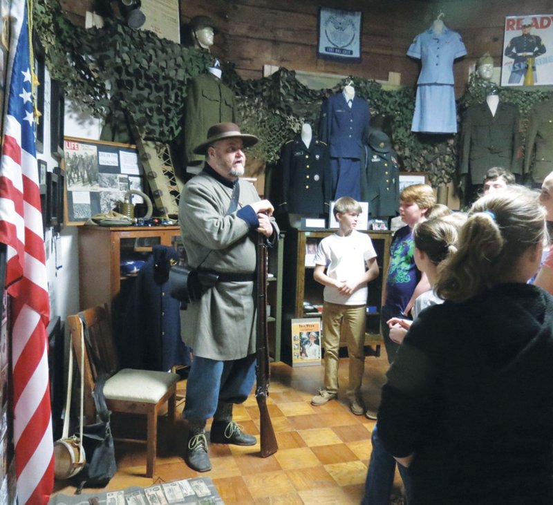 Museum member Robert Swain, a Civil War historian, dresses in a period uniform for a program at the Museum of Veterans and Military History in Vilonia. Neighbors and one-time residents of what was once a family home have reported strange occurrences at the location.