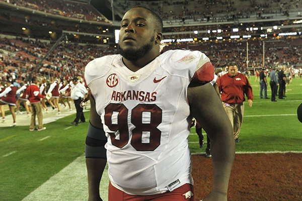 Arkansas defensive tackle Byran Jones heads off the field following the Razorbacks 52-0 loss to Alabama Saturday at Bryant-Denny Stadium in Tuscaloosa, Ala. 