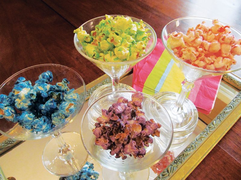 Simple popcorn becomes simply special served in sparkly champagne glasses as a fun party appetizer. Fluffy kernels can easily be tinted to match wedding colors or a variety of party themes.