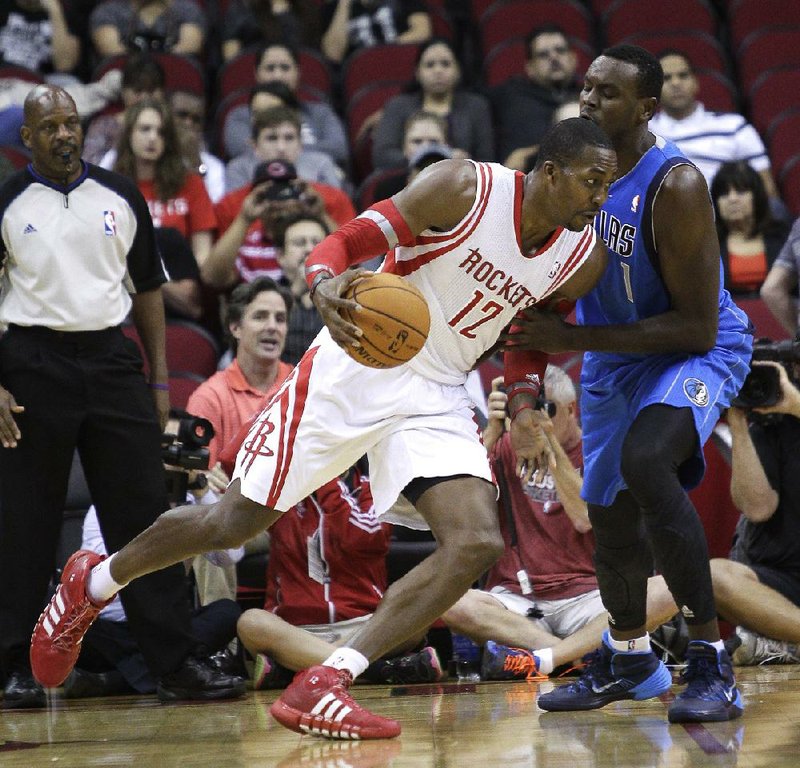 After a season with the Los Angeles Lakers, Dwight Howard (12) has put the drama behind him and is focused on helping the young Houston Rockets compete for an NBA title. 