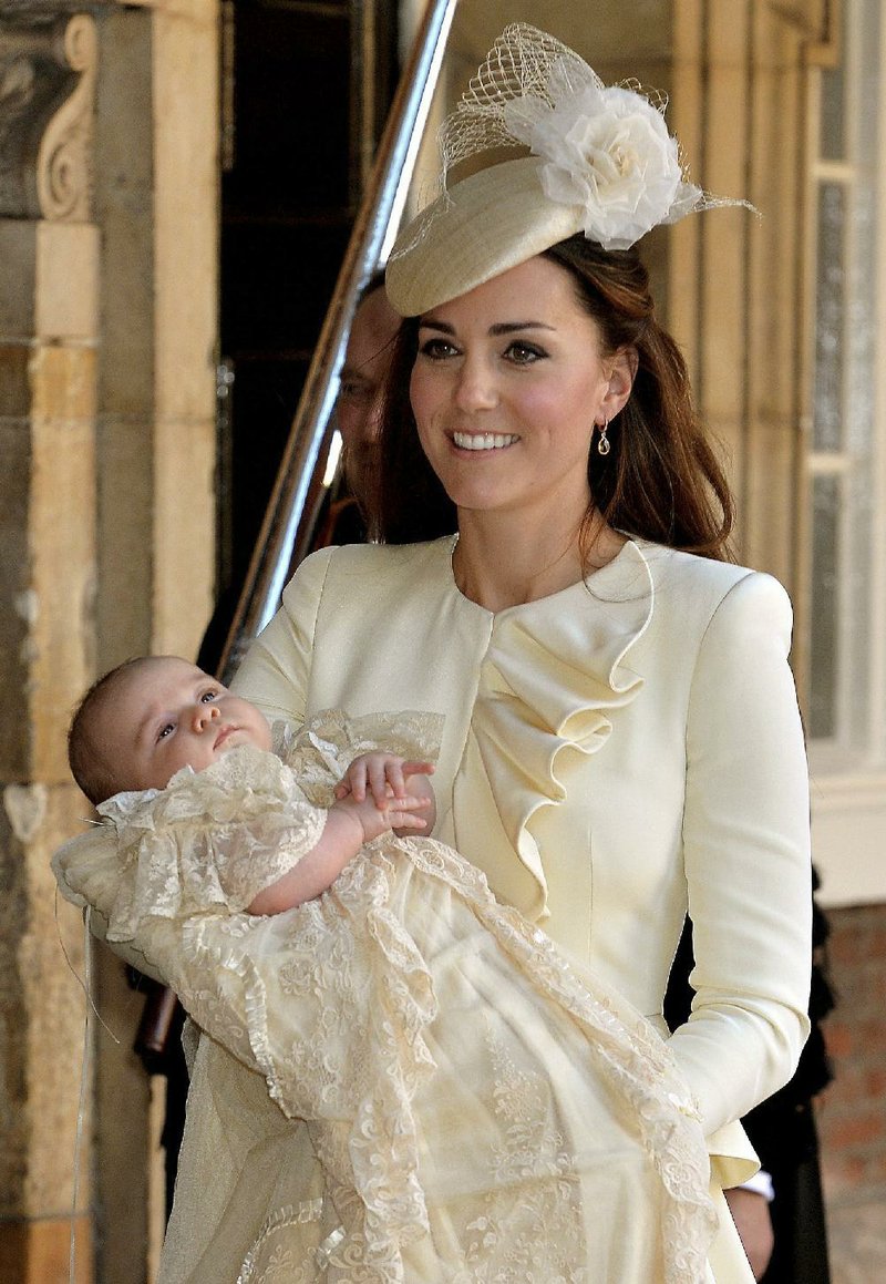 Kate, the Duchess of Cambridge, carries her son, Prince George, after his christening Wednesday at the Chapel Royal in St James’s Palace in London. 