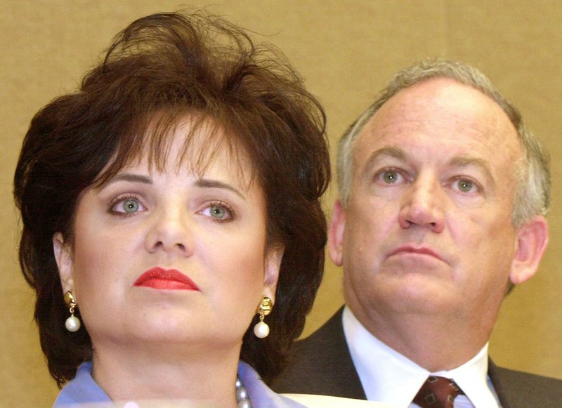 In this May 24, 2000, file photo, Patsy Ramsey and her husband, John, parents of JonBenet Ramsey, listen at a news conference in Atlanta regarding their lie-detector examinations for the murder of their daughter.