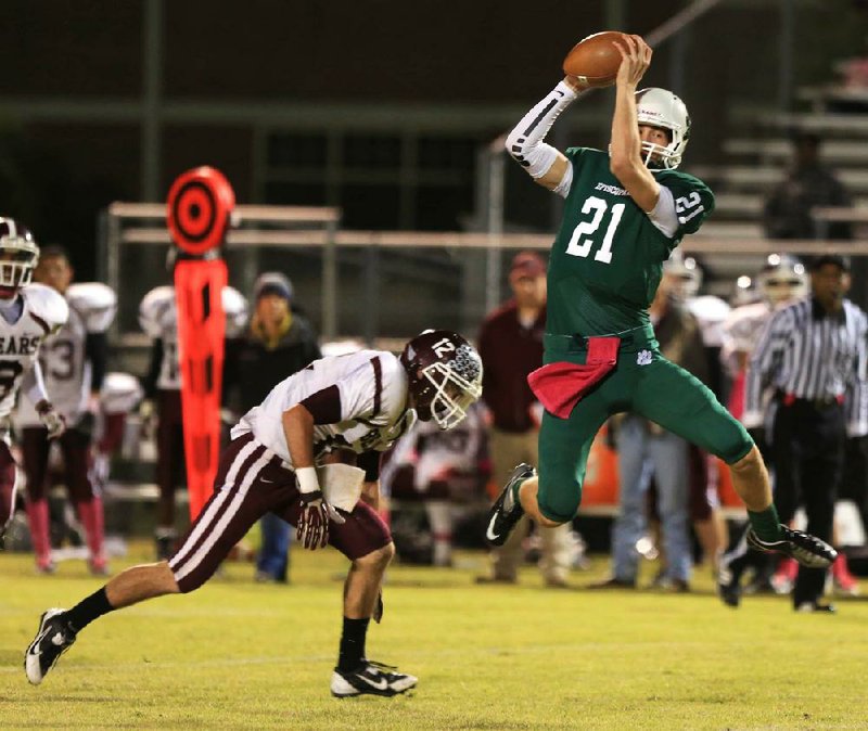 Episcopal Collegiate’s Nick Becton (21) catches a pass over the middle in front of Barton defender Tristian Graves (12) during Friday’s game in Little Rock. Episcopal Collegiate finished with 364 yards of offense as quarterback William Pollock was 25 of 43 for 310 yards and 3 touchdowns. 