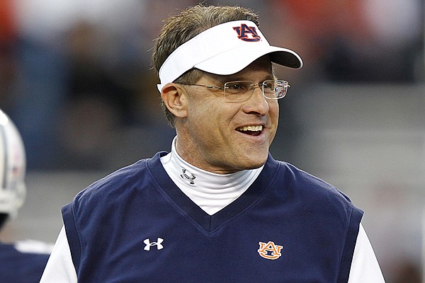 Auburn head coach Gus Malzahn walks around before the first half of an NCAA college football game against Florida Atlantic on Saturday, Oct. 26, 2013, in Auburn, Ala. (AP Photo/Butch Dill)