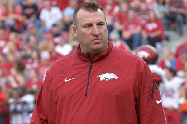 Arkansas coach Bret Bielema walks the field prior to an Oct. 19, 2013 game against Alabama at Bryant-Denny Stadium in Tuscaloosa, Ala. 