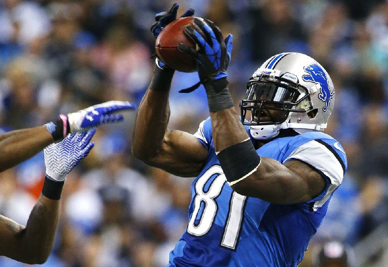 Detroit Lions wide receiver Calvin Johnson (81) pulls in a reception against the Dallas Cowboys in the second quarter of an NFL football game in Detroit, Sunday, Oct. 27, 2013. (AP Photo/Duane Burleson)