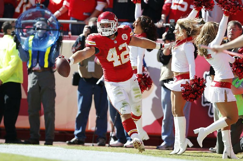 Kansas City Chiefs fullback Anthony Sherman (42) celebrates a touchdown during the first half of an NFL football game against the Cleveland Browns at Arrowhead Stadium in Kansas City, Mo., Sunday, Oct. 27, 2013. (AP Photo/Ed Zurga)