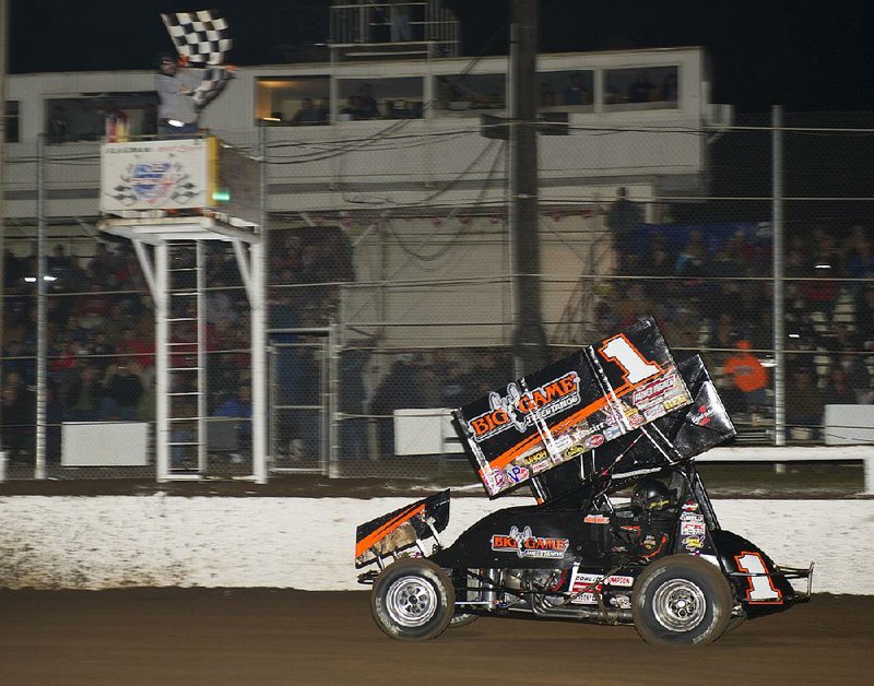 Germantown, Tenneessee native Sammy Swindell takes the checkered flag to win Saturday night's 26th Short Track Nationals feature at I-30 Speedway in Little Rock.

Special to the Democrat-Gazette/JIMMY JONES