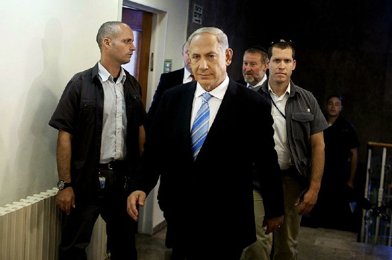 Israeli Prime Minister Benjamin Netanyahu arrives to the weekly cabinet meeting in his Jerusalem office, Sunday, Oct. 27, 2013. (AP Photo/Lior Mizrahi, Pool)