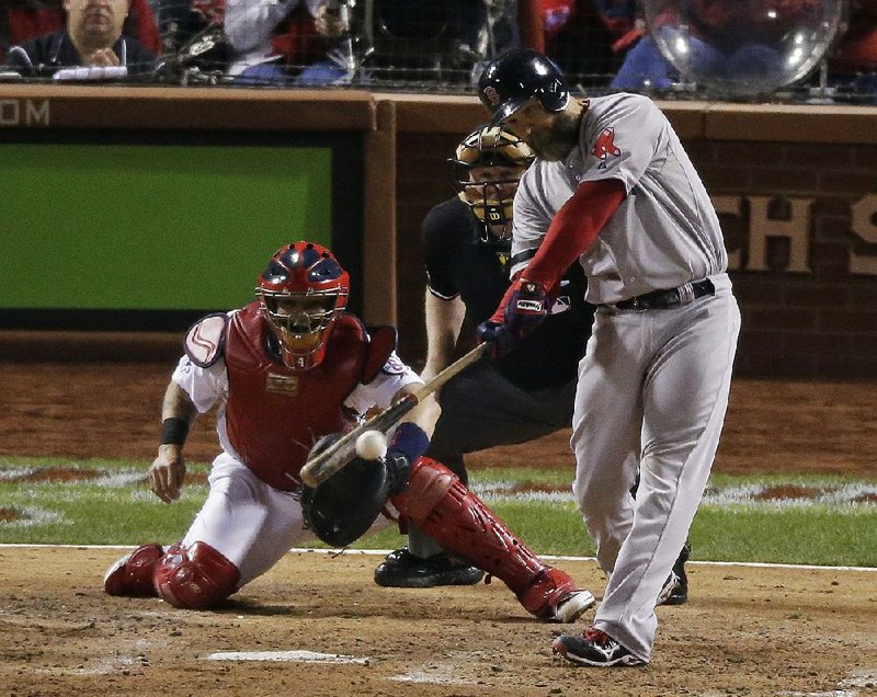 Boston Red Sox's David Ross hits an RBI double during the seventh inning of Game 5 of baseball's World Series against the St. Louis Cardinals Monday, Oct. 28, 2013, in St. Louis. (AP Photo/Charlie Riedel) 