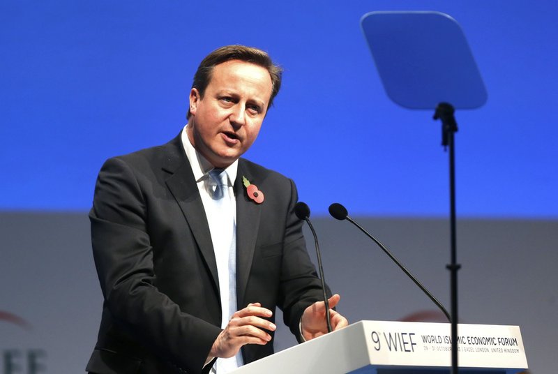 British Prime Minister David Cameron addresses the delegates during the 9th World Islamic Economic Forum at the ExCeL exhibition and convention center in London on Tuesday, Oct. 29, 2013. 