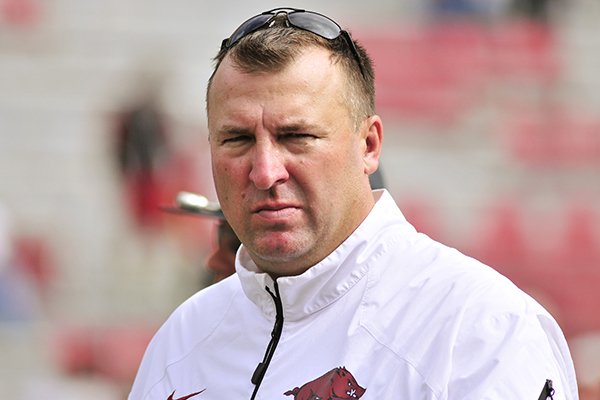 This Oct. 12, 2013 file photo shows Arkansas coach Bret Bielema leaving the field after an NCAA college football game against South Carolina in Fayetteville, Ark. Bielema engaged in some back-and-fort with Auburn coach Gus Malzahn during the summer about the pace of college offenses. The two will finally meet on the field this week when the surging Tigers visit the Razorbacks, losers of five straight who are coming off a bye. (AP Photo/April L. Brown, File)
