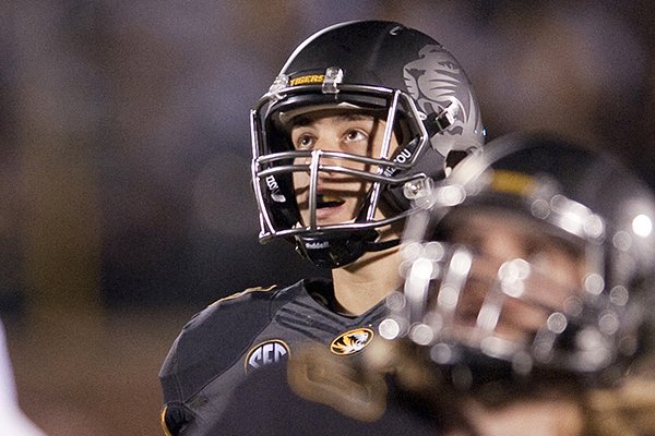  In this Oct. 26, 2013, file photo, Missouri kicker Andrew Baggett, rear, watches his field goal attempt hit the goalpost with teammate Sean Culkin (80), during the second overtime of an NCAA college football game against South Carolina, in Columbia, Mo. South Carolina won 27-24. (AP Photo/L.G. Patterson, File)