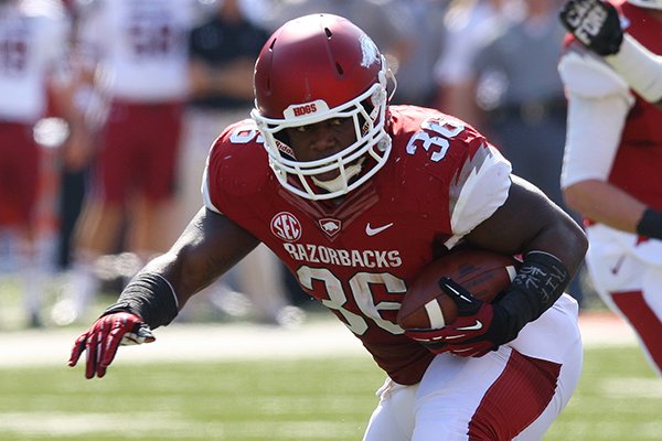 Arkansas fullback Kiero Small runs during an Oct. 12, 2013 game against South Carolina at Razorback Stadium in Fayetteville. 