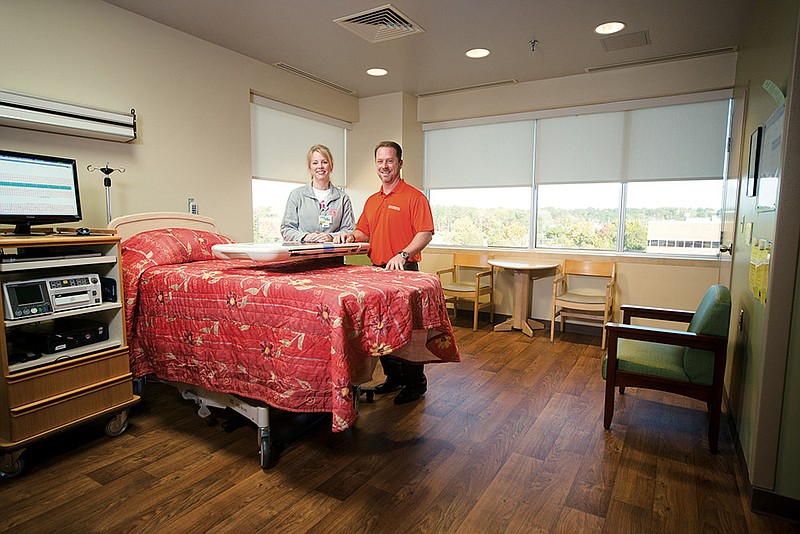 Nurse Brandi Adams and Matt Brumley, director of the Saline Memorial Health Foundation, are shown in one of the remodeled rooms at Saline Memorial Hospital.