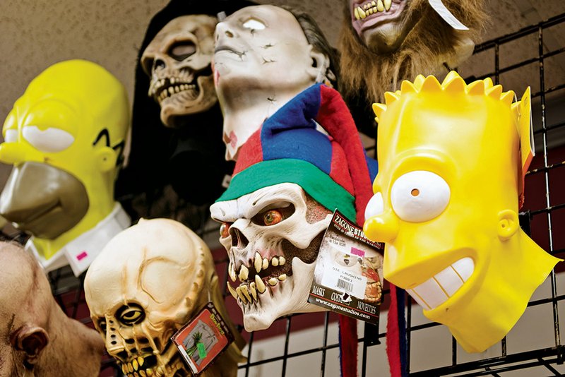 A selection of masks are displayed at a Halloween store in Conway.