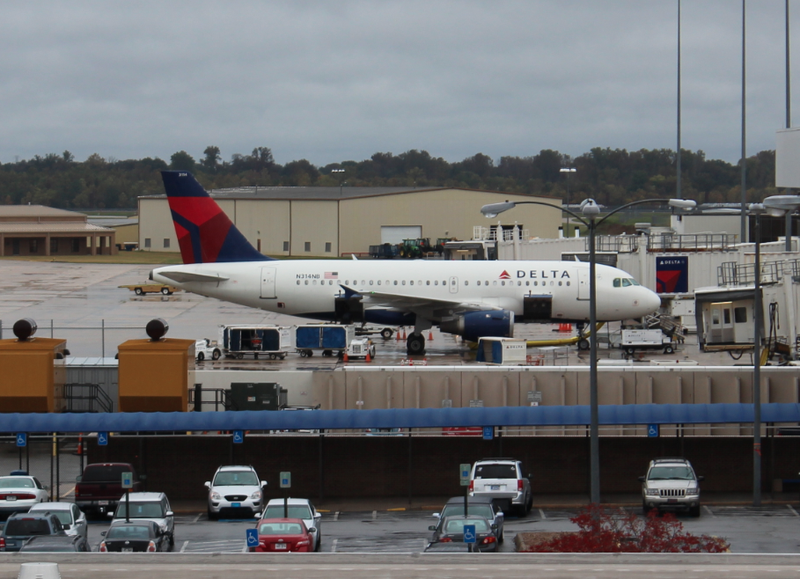 A Delta airplane prepares to leave the gate Thursday morning at the Bill and Hillary Clinton National Airport. The Federal Aviation Administration said Thursday it is changing its rules to allow passengers to use most electronic devices from gate-to-gate.