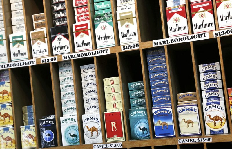 In this March 18, 2013, file photo, cigarette packs are displayed at a convenience store in New York.