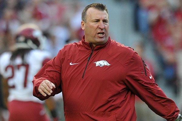 Arkansas coach Bret Bielema instructs players prior to an Oct. 19, 2013 game against Alabama at Bryant-Denny Stadium in Tuscaloosa, Ala. 