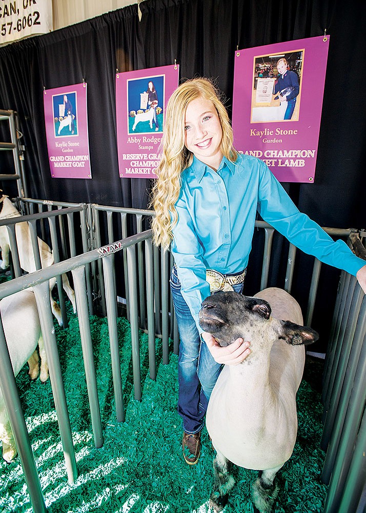 Kaylie Stone, the 13-year-old daughter of Stacey and Tracy Stone of Gurdon, won several awards at this year’s Arkansas State Fair. She is shown here with her Grand Champion Market Lamb, 38 Special.