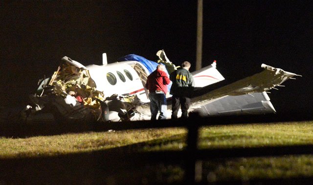 Emergency workers examine the wreckage of a plane that crashed Friday, Nov. 1, 2013 in a field south of U.S. 412 near Bennington Road in Springdale. There were no survivors from the wreck. Washington County personnnel responded to the wreck at 5:46 p.m.