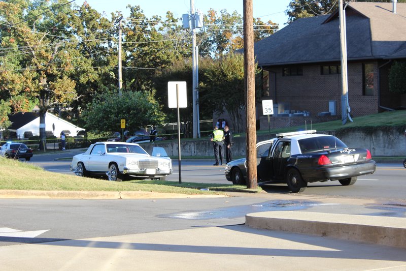 Police investigate a drive-by shooting on 12th Street in Little Rock on Friday afternoon.