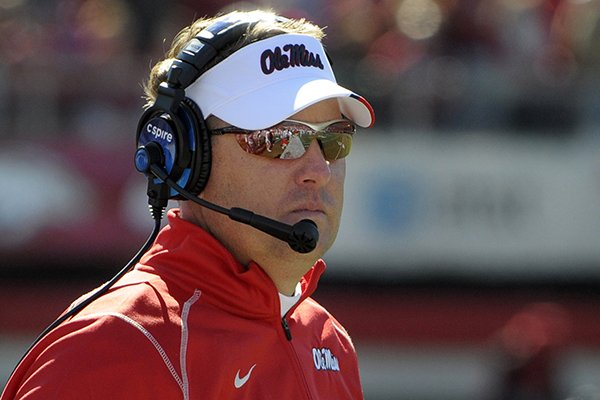Mississippi coach Hugh Freeze watches during the first half of an NCAA college football game against Arkansas in Little Rock, Ark., Saturday, Oct. 27, 2012. Mississippi defeated Arkansas 30-27. (AP Photo/David Quinn)