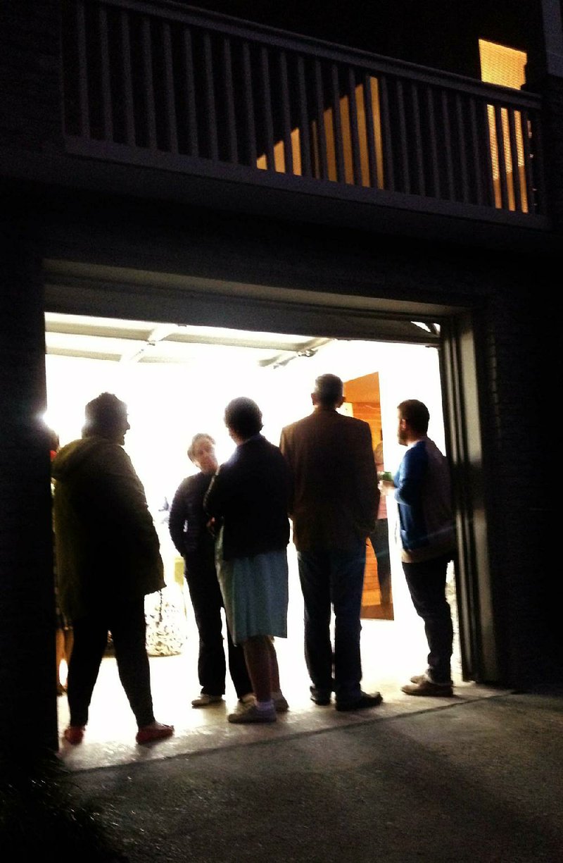 Arkansas Democrat-Gazette/LINDA HAYMES -  Curator Haynes Riley's Good Weather Gallery in the garage of a home at 4400 Edgemere Street in North Little Rock's Lakewood neighborhood,  for a story slugged adgtuegaragegallery1105