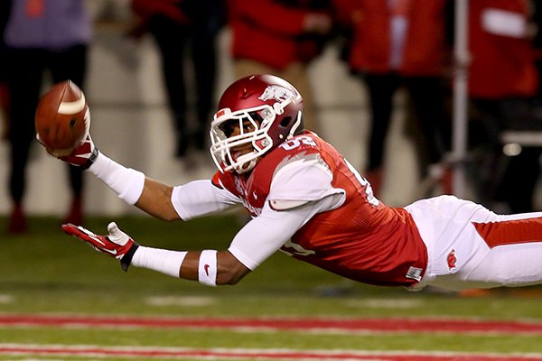 Arkansas tight end Jeremy Sprinkle dives for a ball in the end zone during the third quarter of Saturday's game against Auburn at Razorback Stadium in Fayetteville. 