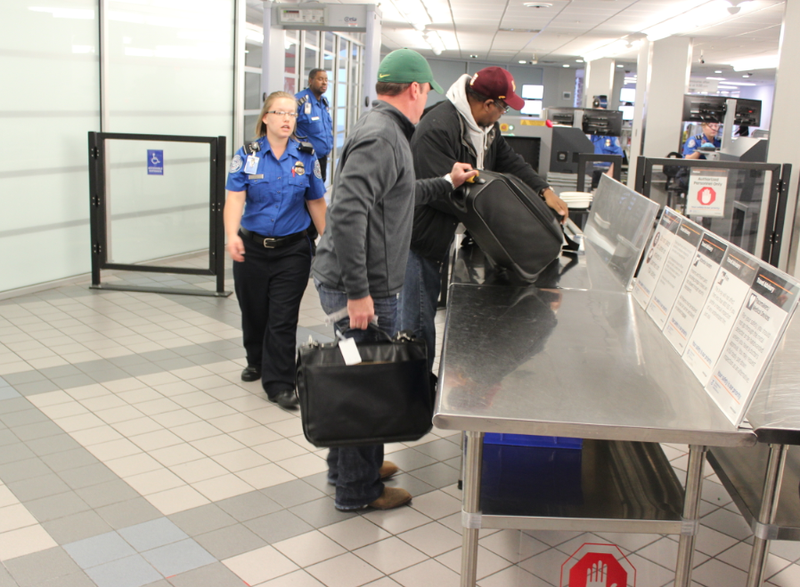 Passengers make their way through the new TSA PreCheck security checkpoint Wednesday morning at the Bill and Hillary Clinton National Airport.