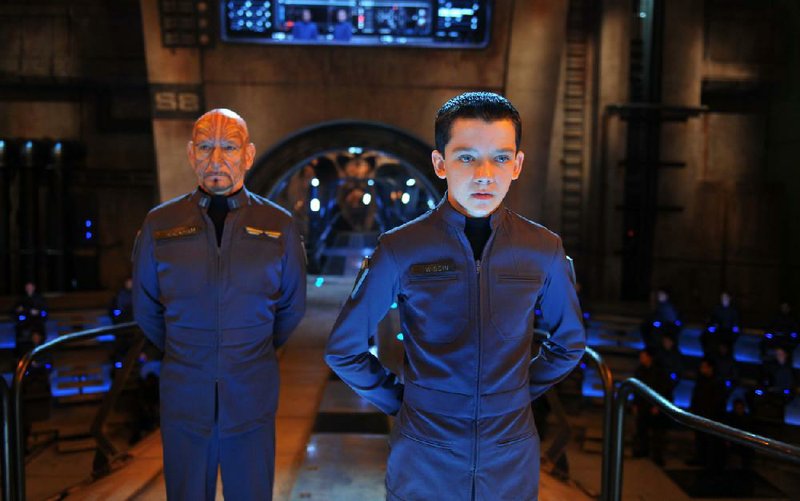 Ben Kingsley (left) and Asa Butterfield star in the sci-fi film Ender’s Game. It came in first at last weekend’s box office and made $27 million. 