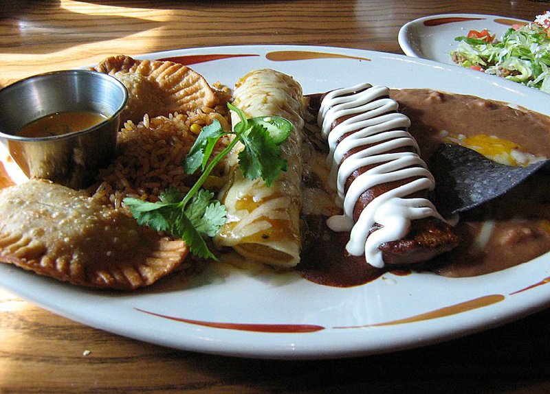 A Create Your Own Combo plate at On the Border in Sherwood includes beef empanadas, a green chile chicken enchilada and a pork tamale plus rice and beans. 