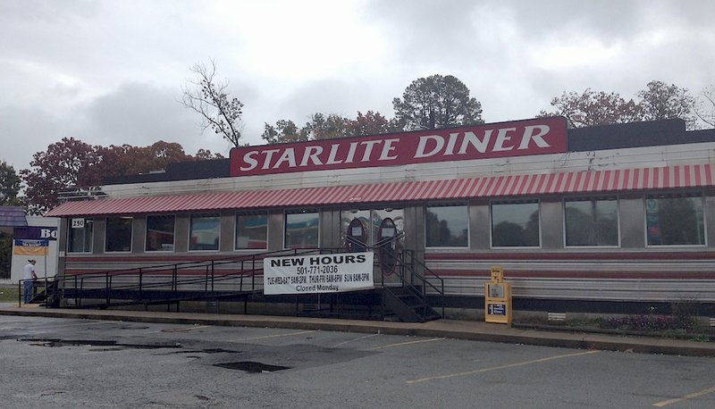 Allen Littlefield, 34, of Sherwood repairs a side door at Littlefield's Starlite Diner in North Little Rock on Wednesday after an early-morning break-in.