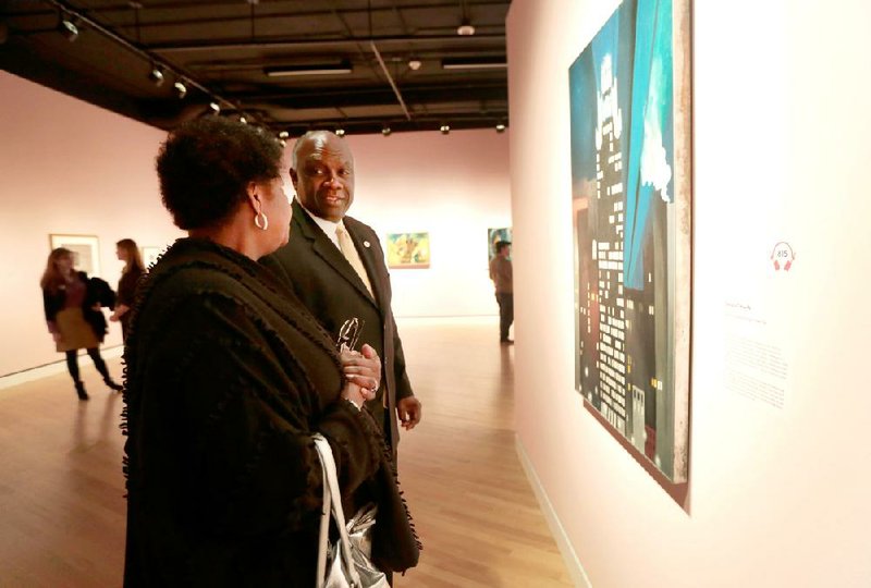 NWA Media/JASON IVESTER --11-07-13--
Fisk University President H. James Williams and Chair of the Board of Trustees Barbara Bowles look over a Georgia O'Keefe painting on Thursday, Nov. 7, 2013, inside the Crystal Bridges Museum of American Art in Bentonville.