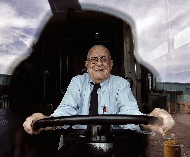 Tommy DeVore takes his old-time place behind the steering wheel of a Central Arkansas Transit Authority bus. DeVore started his 65-year career as a driver for the transit system. “I just loved the driving part,” he says on the way to his next stop: retirement. 