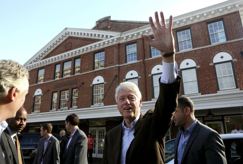 Former President Bill Clinton waves after the "Putting Jobs First" event on Wednesday, Oct. 30, 2013, in Roanoke, Va. 