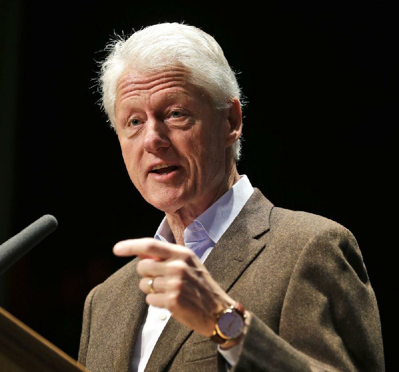 Former President Bill Clinton, shown speaking Oct. 30 in Charlottesville, Va., said in an interview Tuesday that while there were flaws in the new health-care law, “the big lesson is that we’re better off with this law than without it.” 