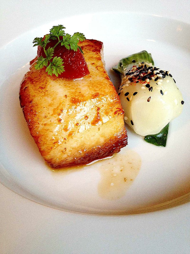 The Broiled Sea Bass with Bok Choy and Tomato Relish heads a selection of delectable entrees at Ashley’s at the Capital. 
