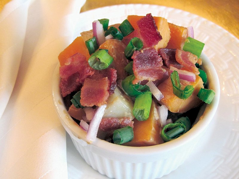 Warm sweet potatoes, mixed with skin-on red potatoes dressed in balsamic vinaigrette and topped with red and green onions with savory crisp bacon, create a new spin on traditional potato salad.