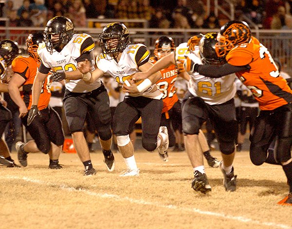    FILE PHOTO RANDY MOLL 
J.D. Speed, Prairie Grove senior running back, runs the ball against Gravette on Nov. 8. Speed scored two touchdowns in the game. The Tigers will host Pulaski Robinson on Friday in a Class 4A first-round playoff game.