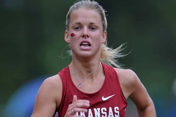 Arkansas' Dominique Scott approaches the finish line during the the 25th annual Chile Pepper Cross County Festival Saturday, Oct. 5, 2013. 