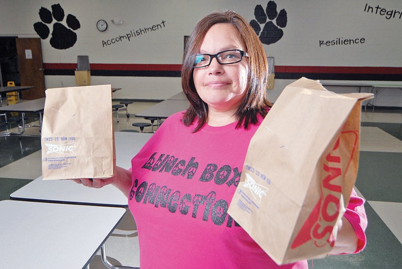 In an attempt to prevent families from going hungry, Susan Hedin started Lunchbox Connection, a program that provides sack lunches to children and their parents in the Cabot School District area when school is on break.